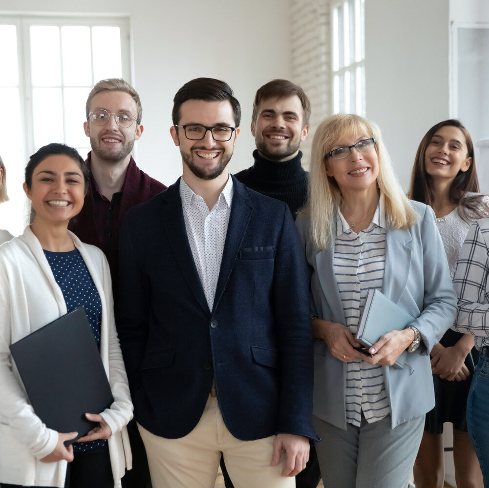 Group,Portrait,Of,Happy,Diverse,Colleagues,Of,Different,Ages.,United