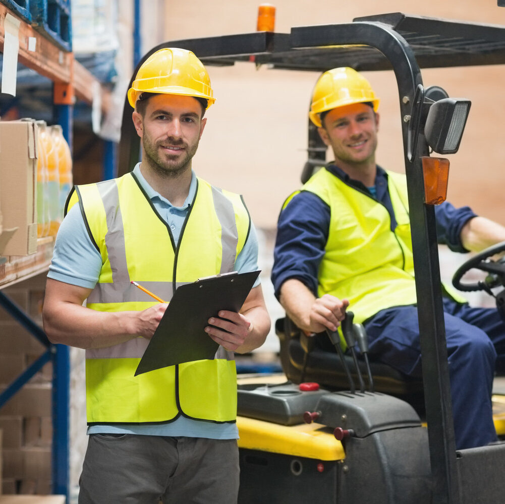 Smiling,Warehouse,Worker,And,Forklift,Driver,In,Warehouse